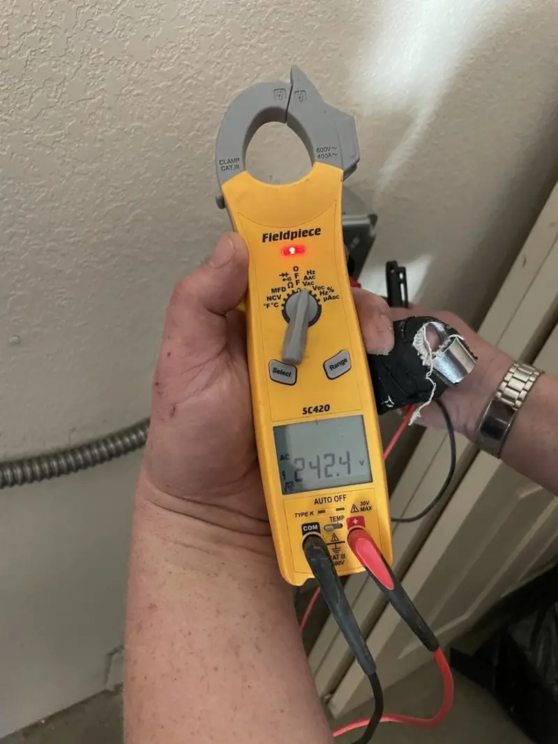 Voltage testing with clamp meter during Ceiling Fan Installation in Aransas Pass